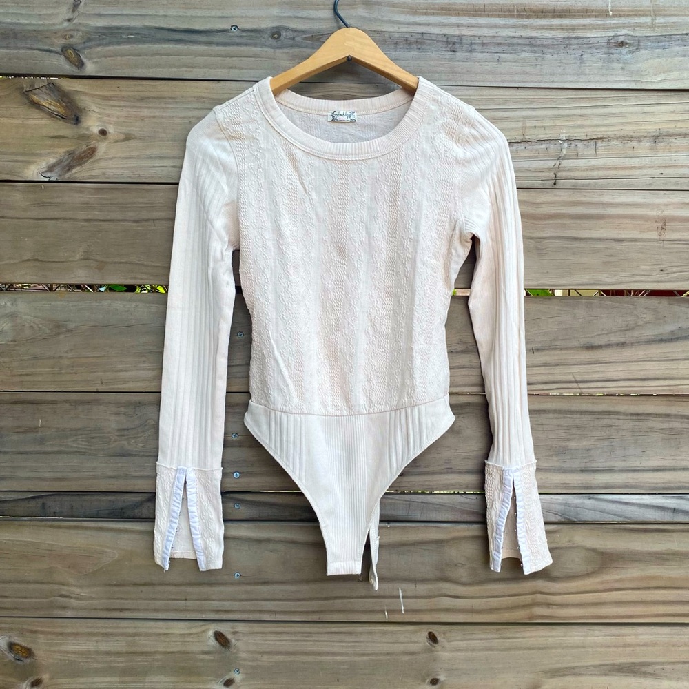 Free People Cream Bodysuit with Elegant Design